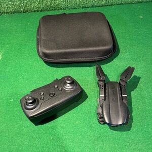 E99 foldable RC quadcopter drone and its remote control